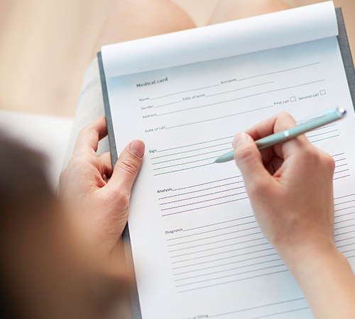 Photo of a patient filling out a medical form